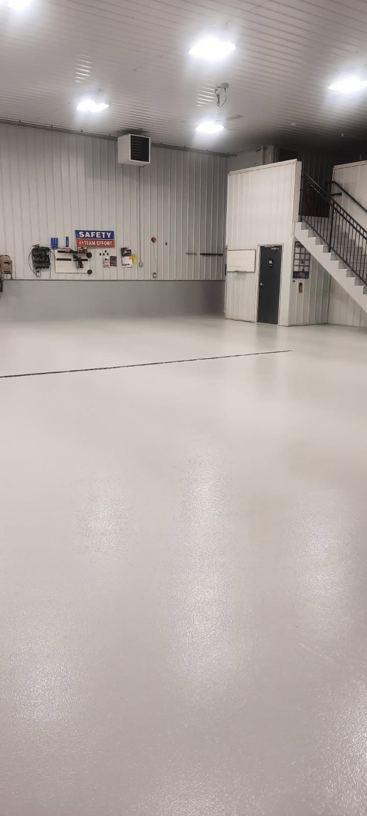 Commercial shop floor — heavy-duty polyurea system with anti-slip finish